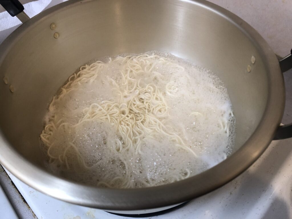 Once boiling, add the noodles.